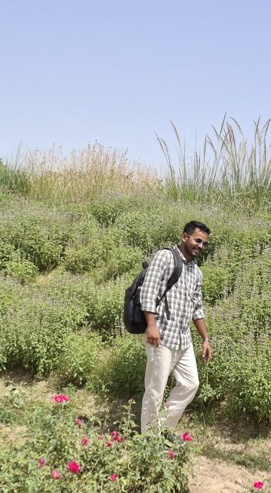 Subhash Kumar walking through the aromatic farm at Soil Ventures
